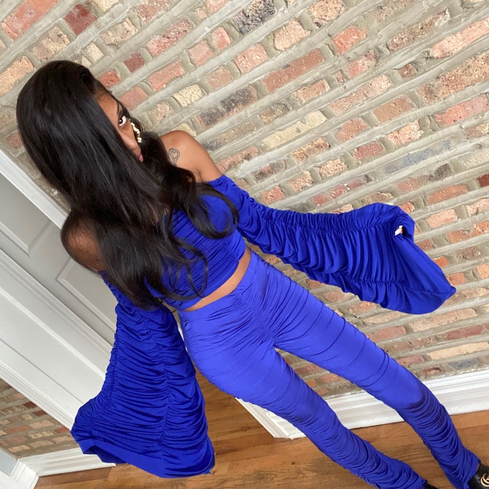 Two piece blue pant suit with bell sleeves